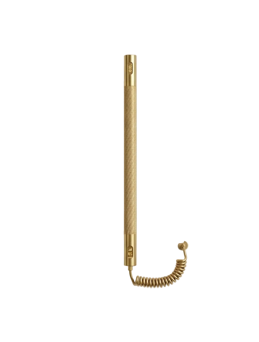 Gold-colored tool with coiled cable on a light gray background